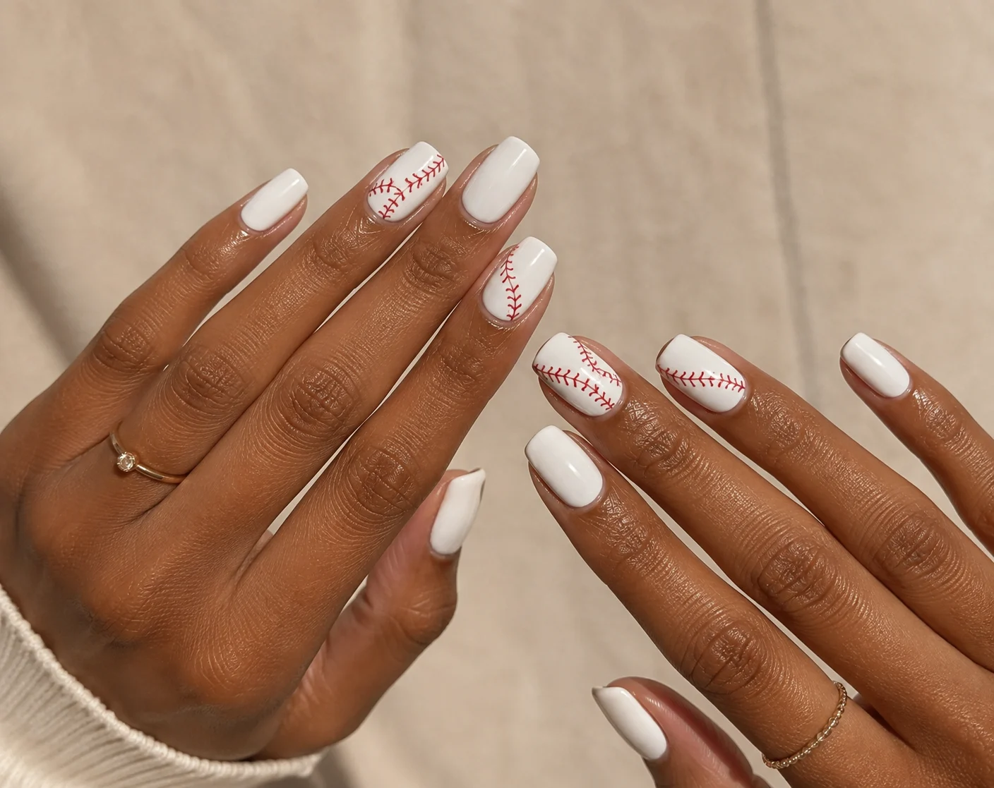 our-services-03 White baseball stitch nails with curved red nail art