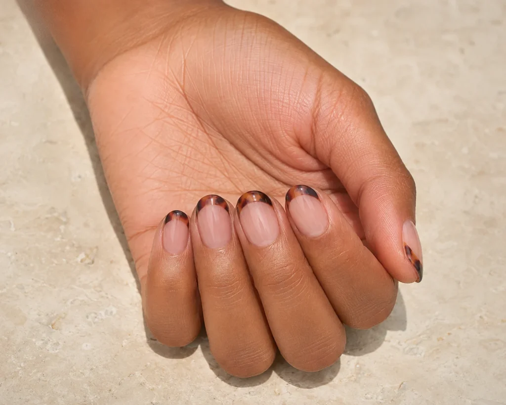 Short nail designs with layered amber and espresso tortoiseshell French tips