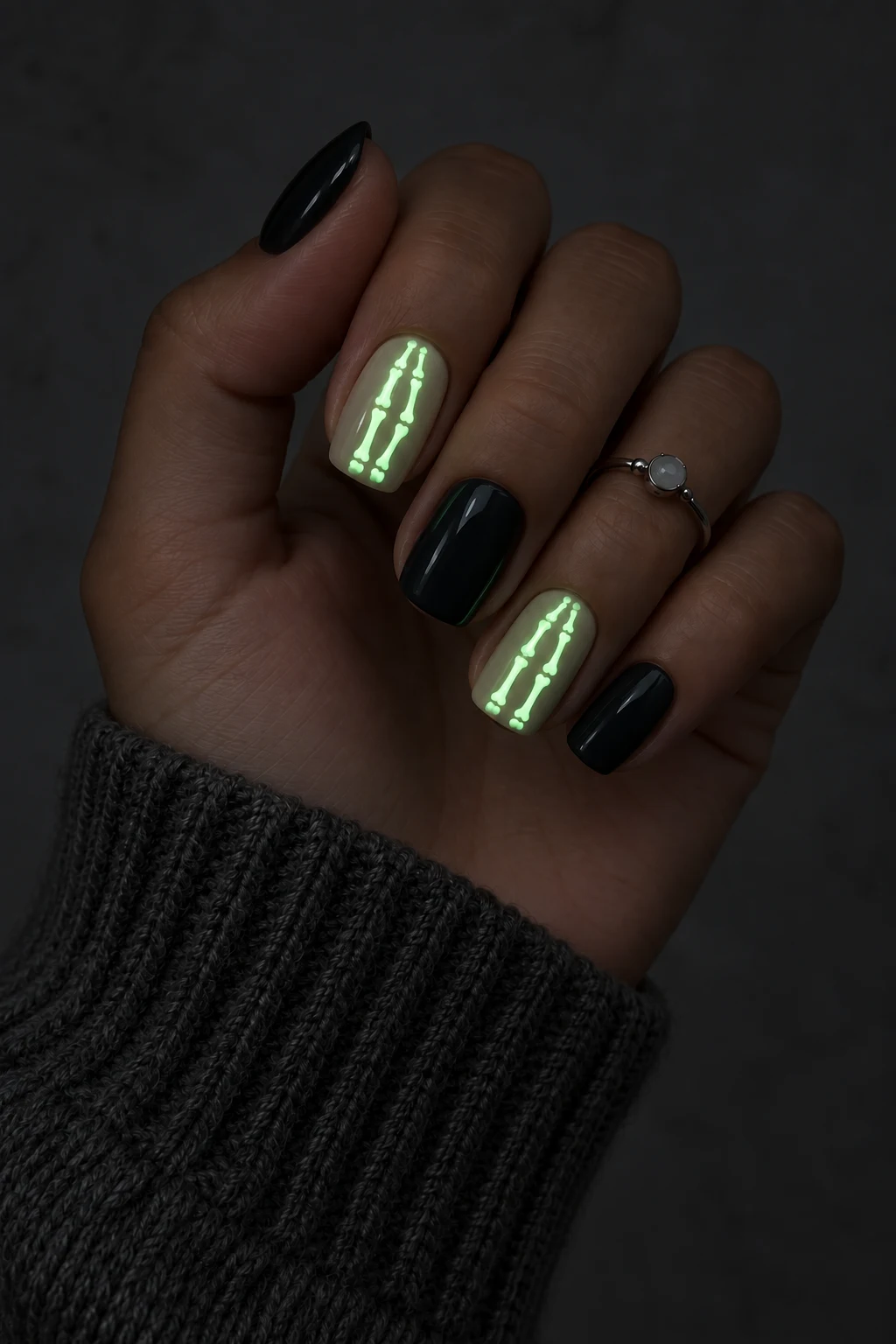 11+ Best Glow-in-the-Dark Short Halloween Nails Short Halloween nails with miniature skeleton lines glowing spectral green.